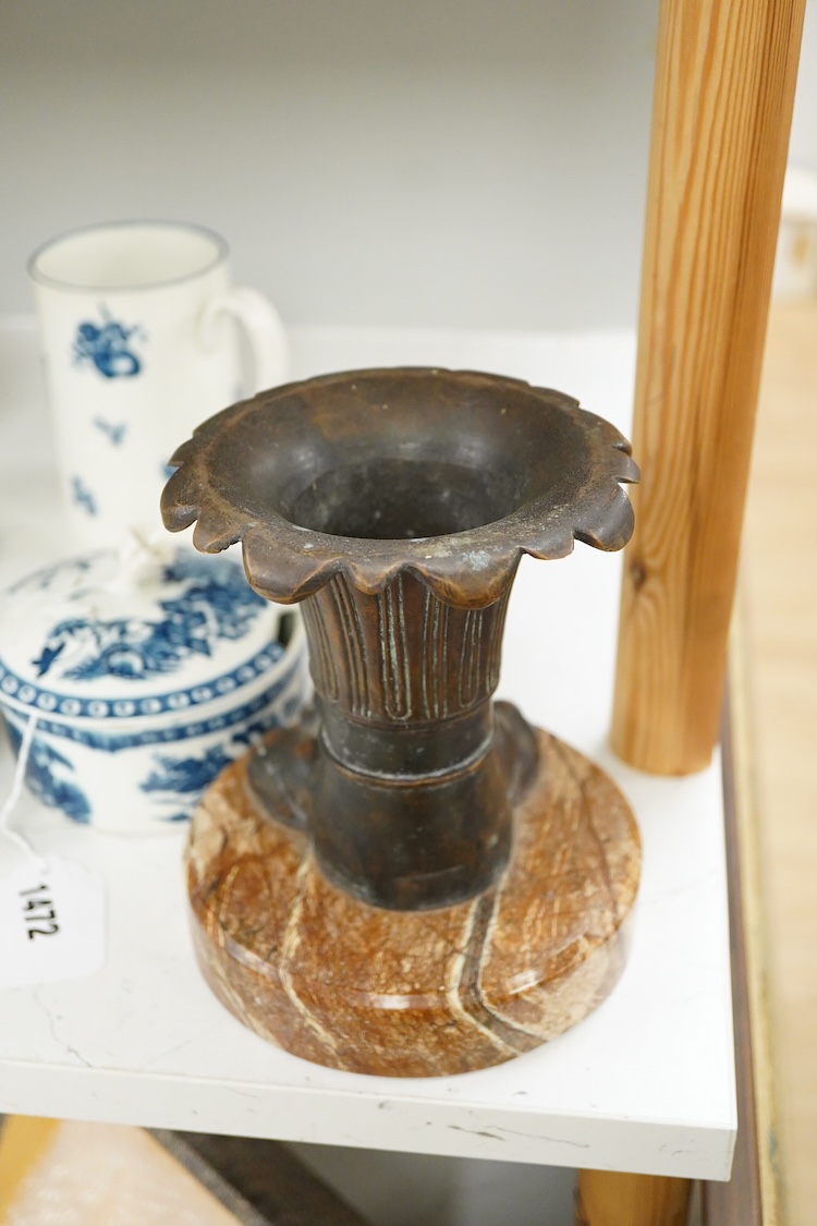 An Italian bronze vase in the form of a lion paw, raised on circular marble base, 17cm high